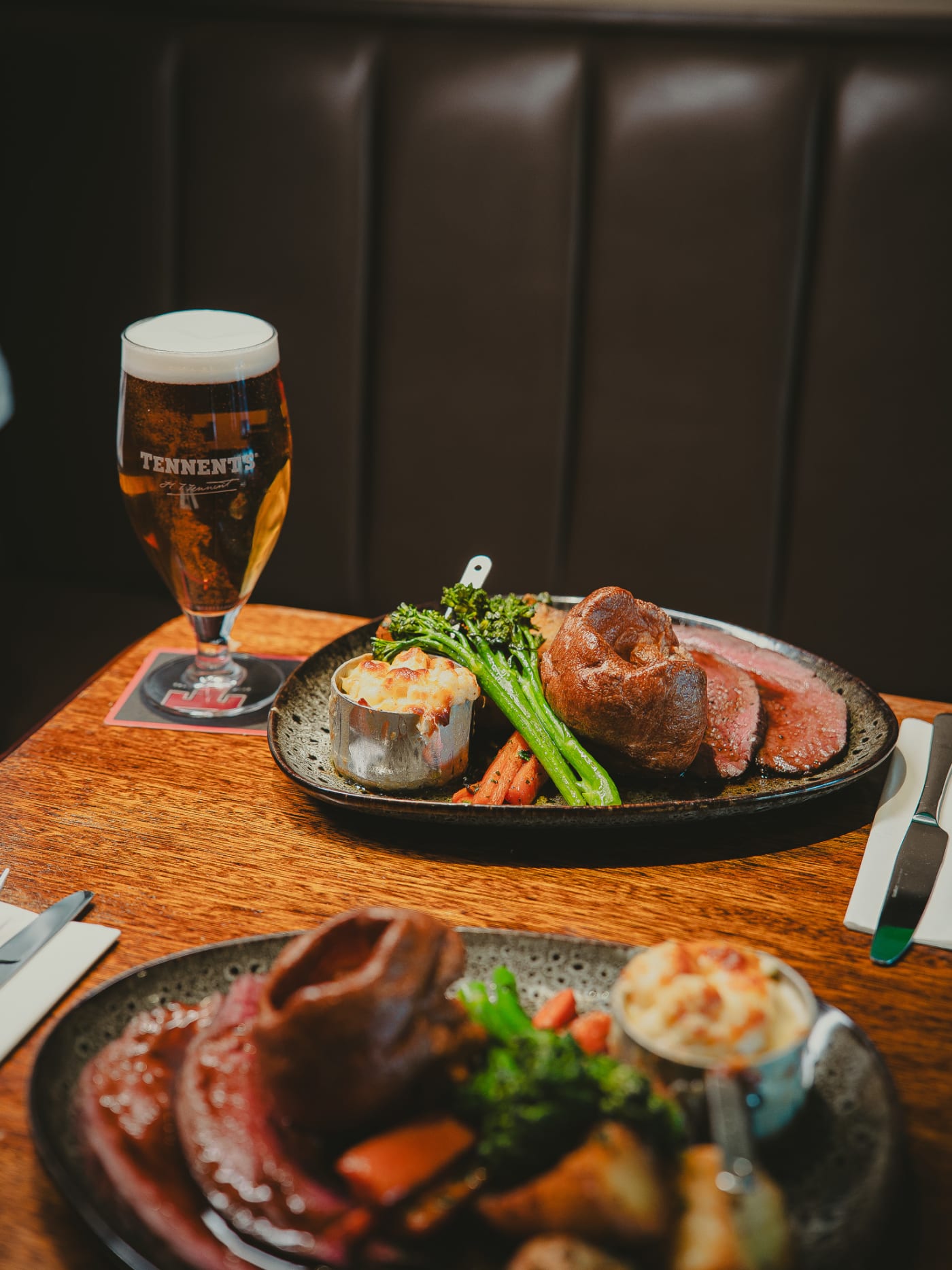 Pouring gravy over a Sunday roast at The Ship Inn, Musselburgh