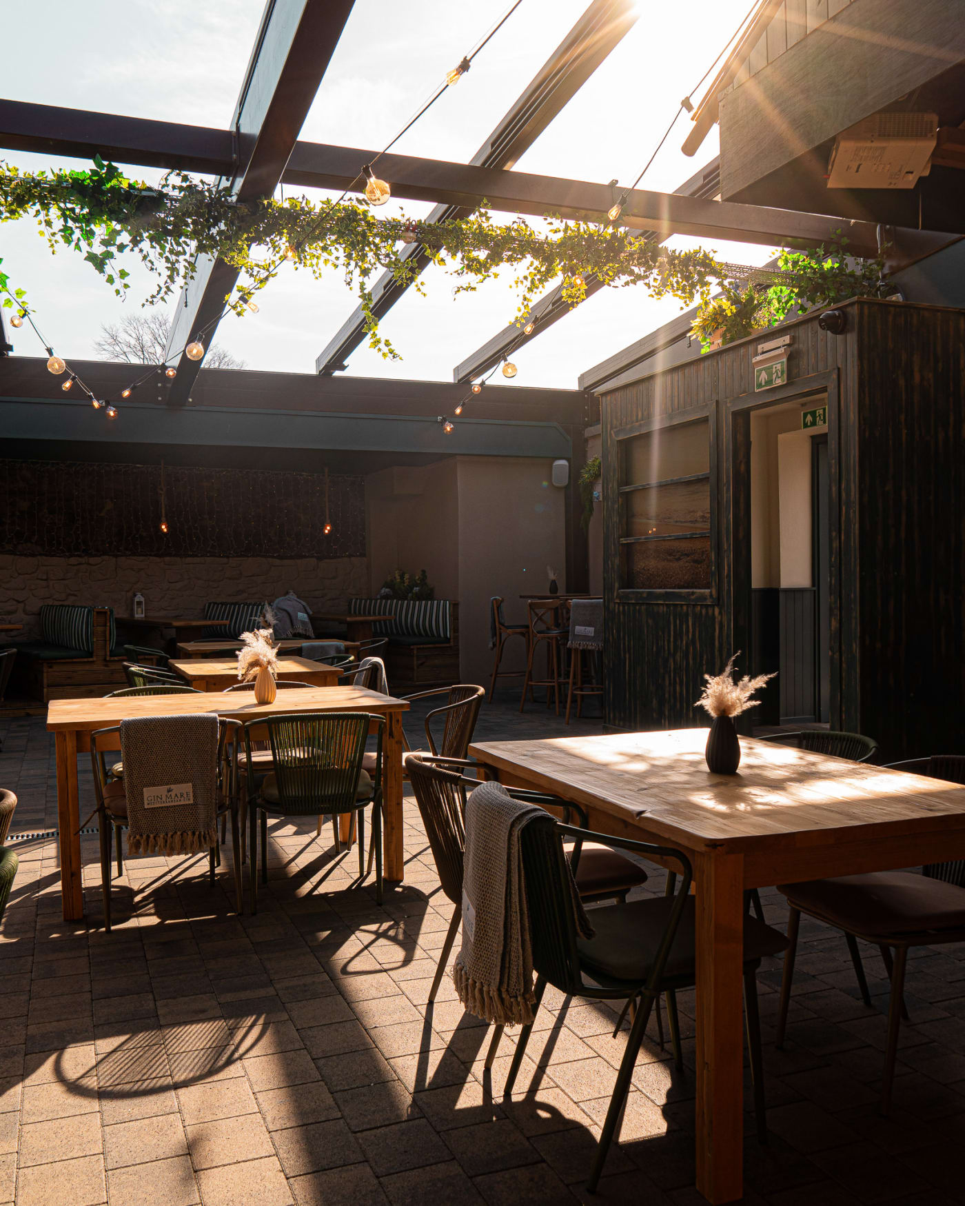 Sunlit tables in The Courtyard at The Ship Inn