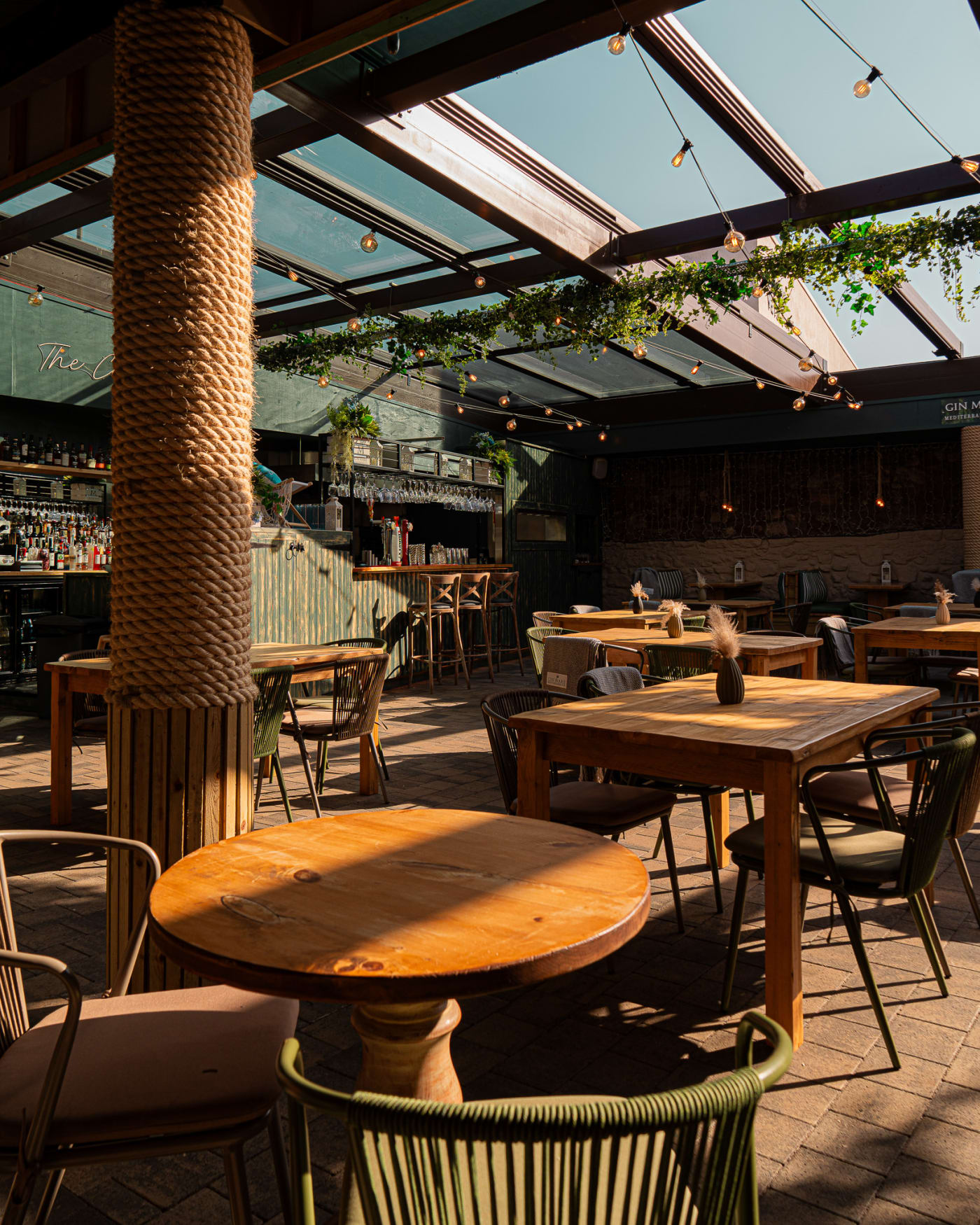The Courtyard beer garden with wooden tables at The Ship Inn