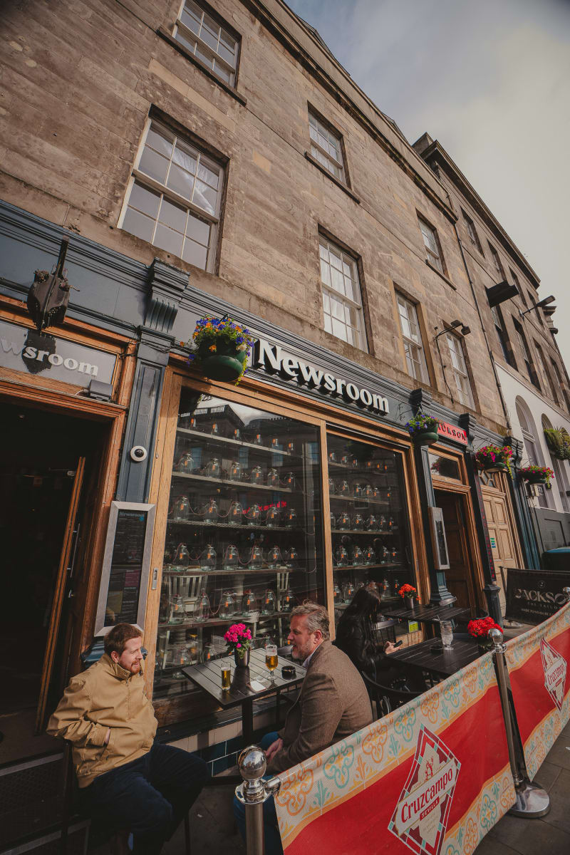 Newsroom facade under a blue sky on Leith Street