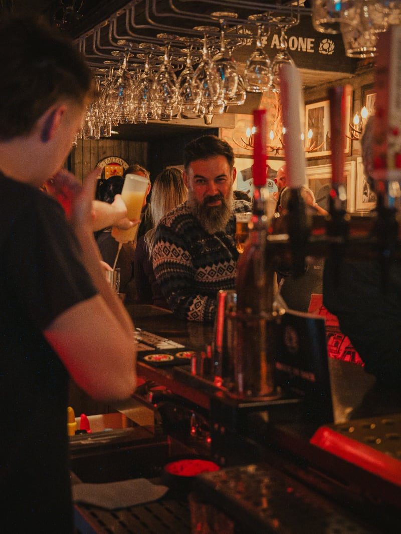 Bar staff pouring a pint at The Piper's Rest
