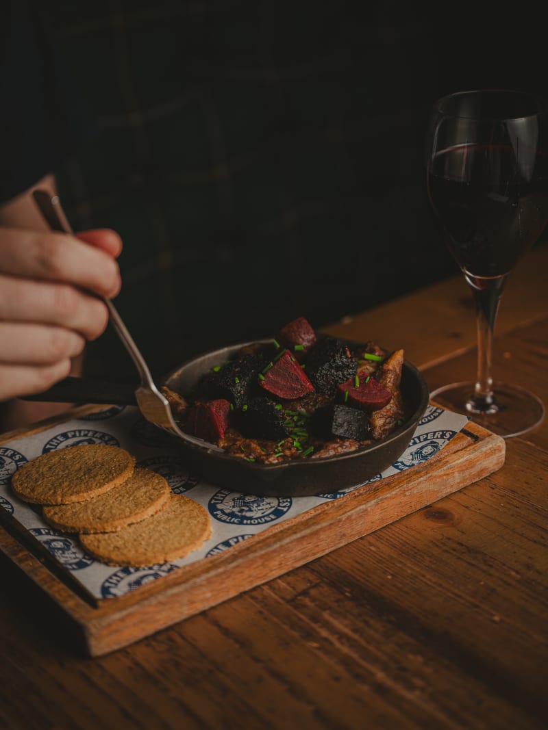 Sharing board with red wine at The Piper's Rest