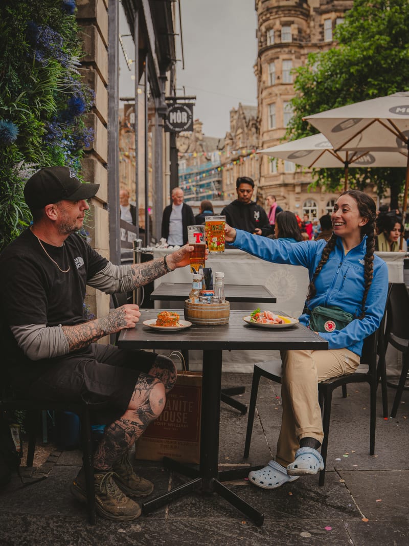 Guests toasting on the terrace at The Piper's Rest, Edinburgh