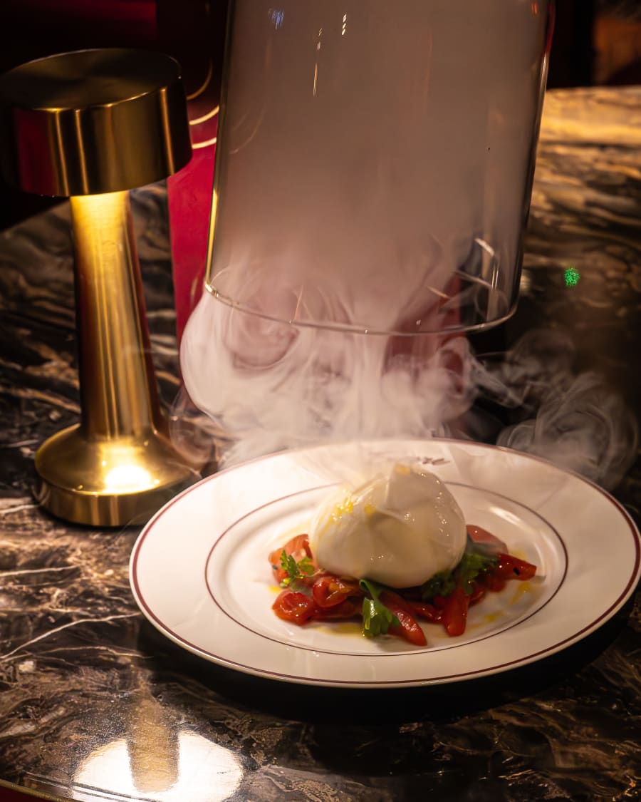 Burrata with a dry ice smoke effect at Encore
