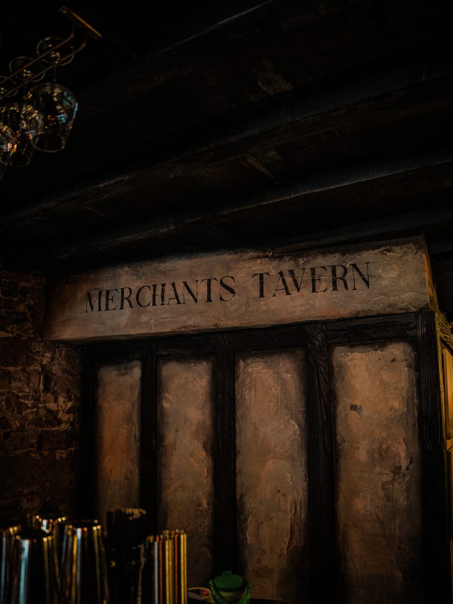 Hand-painted Merchants Tavern lettering on the panelled wall at Merchant Tavern, Edinburgh
