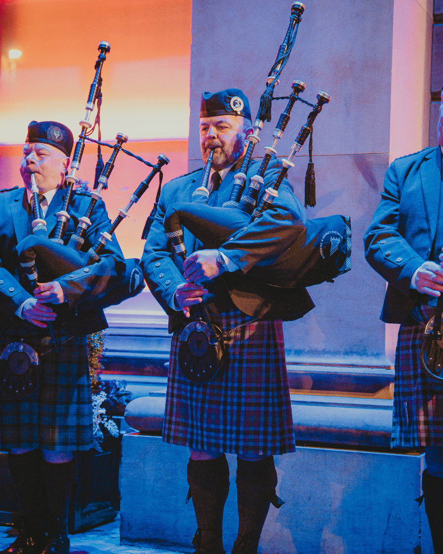 Pipe band in kilts playing at Burns Night at The Dome