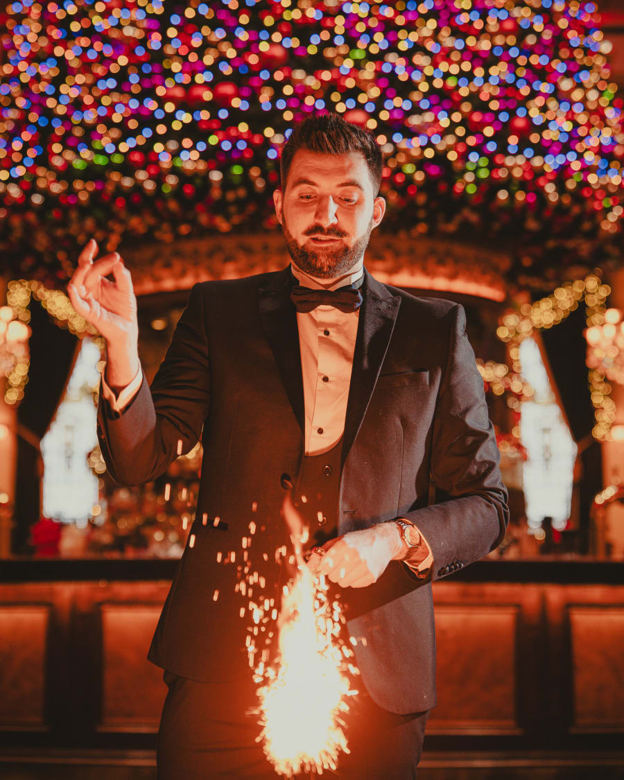 Magician conjuring sparks at The Dome's New Year's Eve party