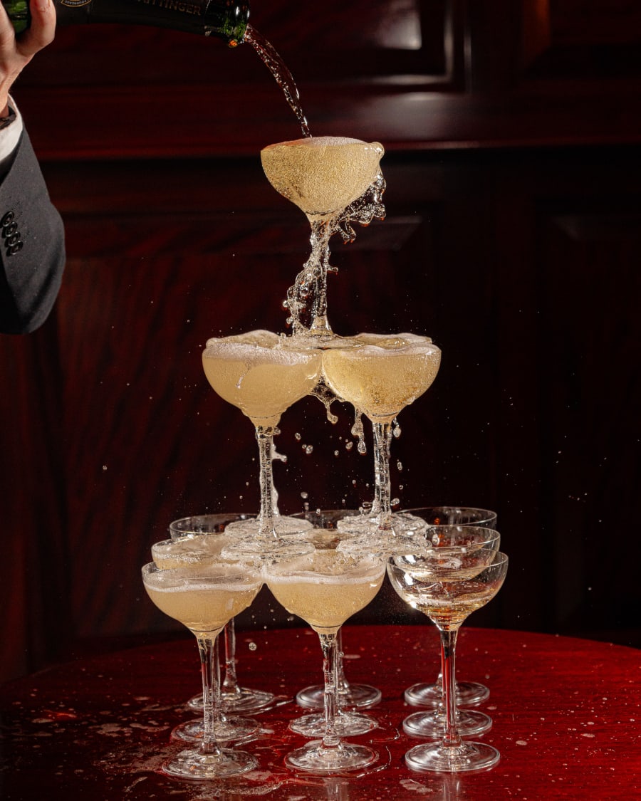 Champagne poured over a tower of coupes at The Dome