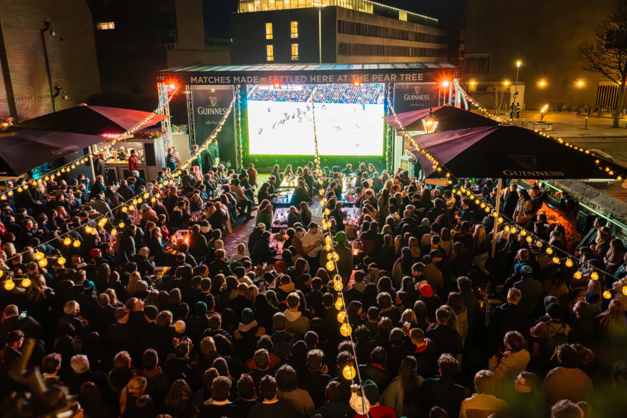 Award-winning night shot of the packed beer garden during a Six Nations big screen match at The Pear Tree, Edinburgh