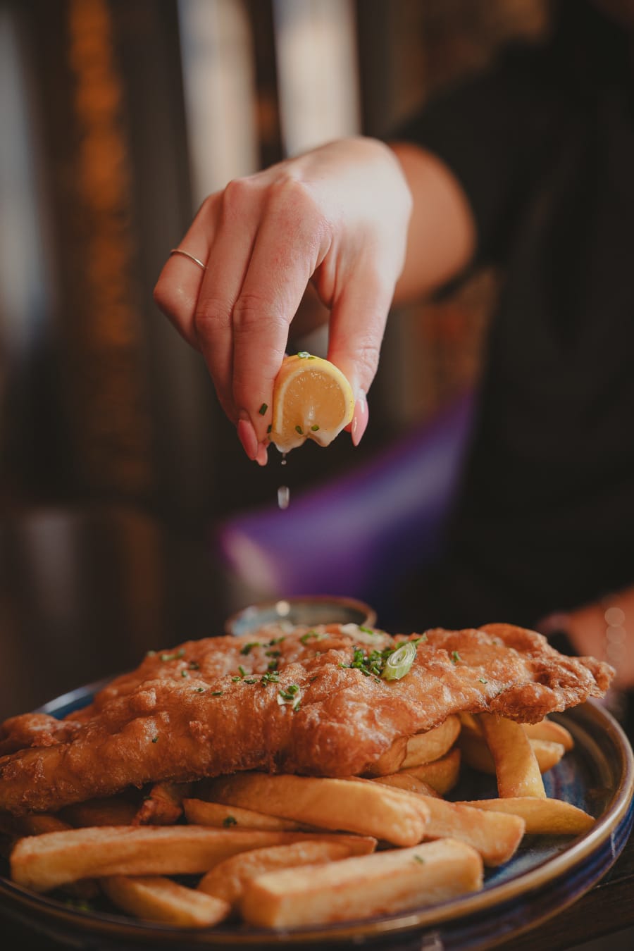 Lemon squeezed over breaded fish and chips at The Pear Tree, Edinburgh