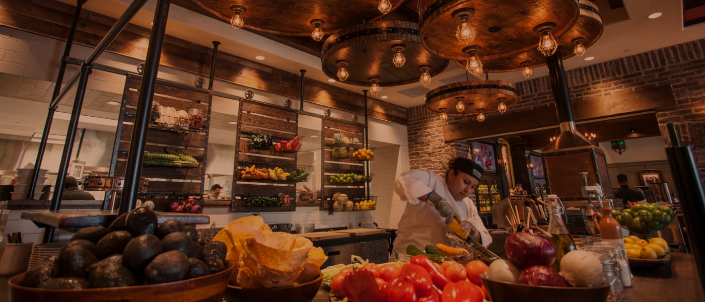 chef in kitchen using fresh ingredients