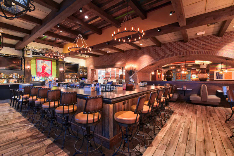 interior bar area with table and chairs
