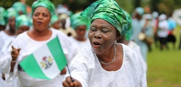 nigerian woman holding the flag