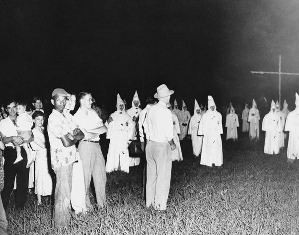 A lone African-American man attends a Klan rally in Jackson, 1950.