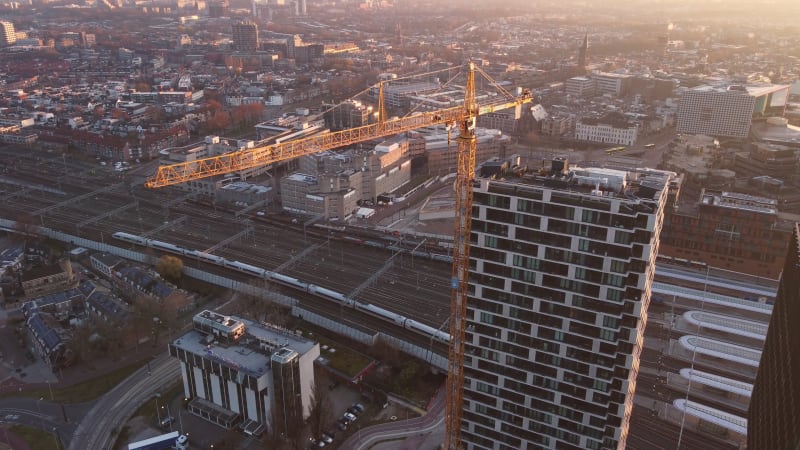 Aerial high pan footage over sky scrapers in the city center of Utrecht, Netherland