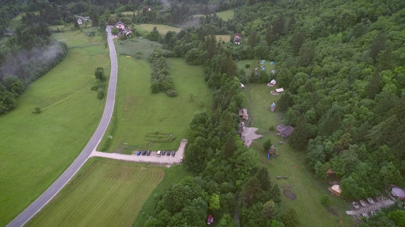 Aerial view of an excursion camp surrounded by nature.