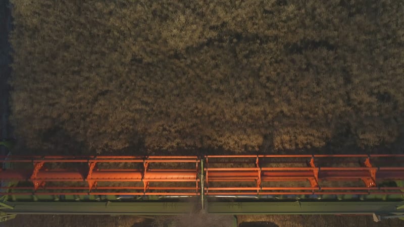 Combine Harvester at Night During the Harvest