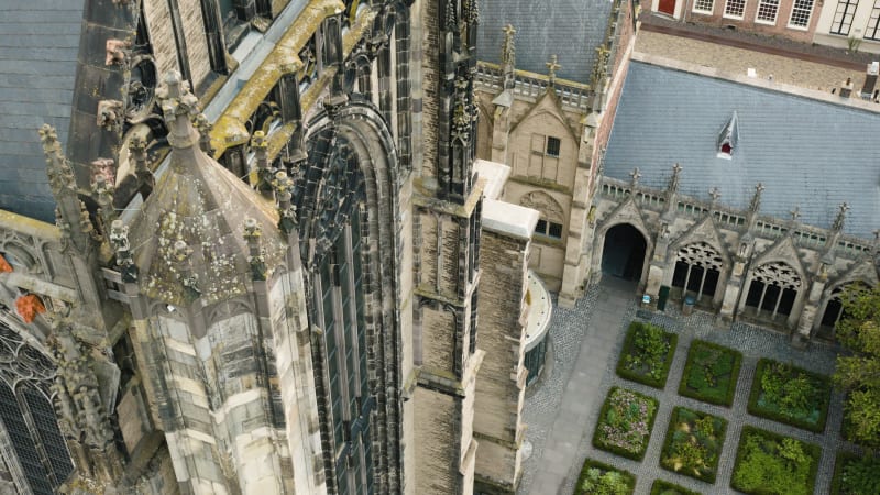 An aerial perspective captures the maintenance and restoration scaffolding the majestic Dom tower in the historic city of Utrecht.