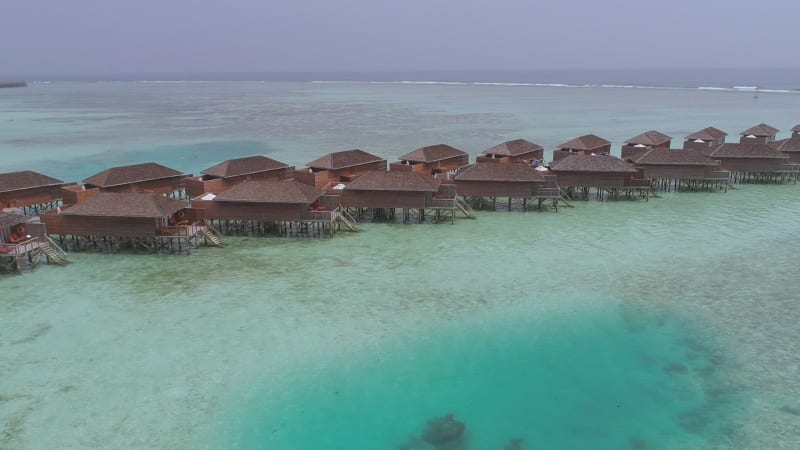 Aerial view of resort in the middle of forest.