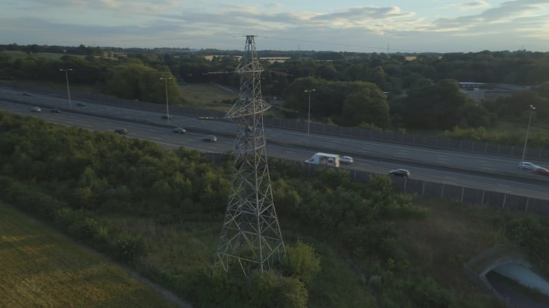 Aerial View of an Electricity Pylon and Motorway