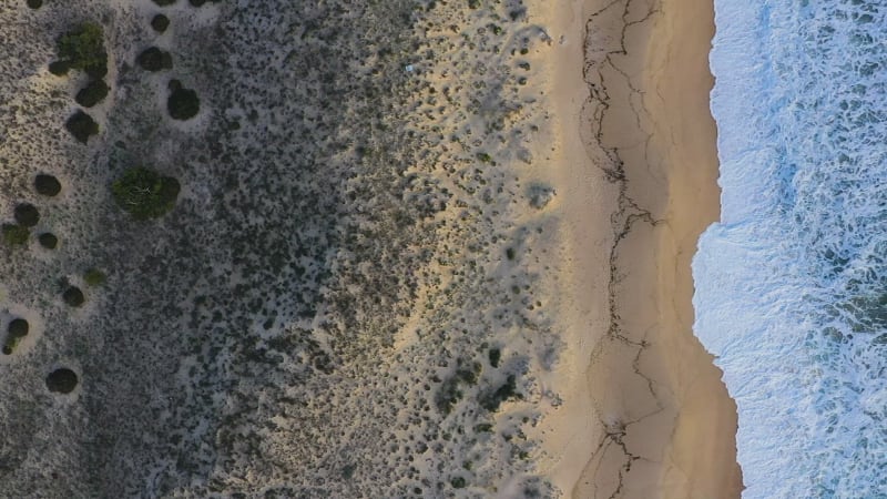 Aerial view of sandy beach.