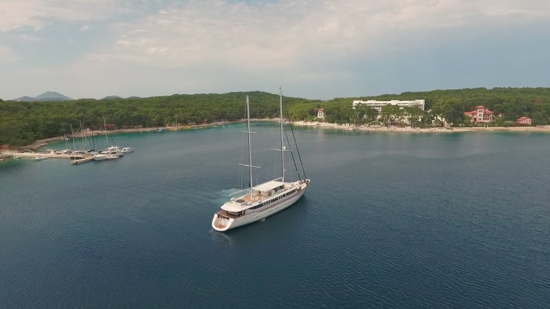 Aerial view of touristic sailing boat anchored at Adriatic sea.