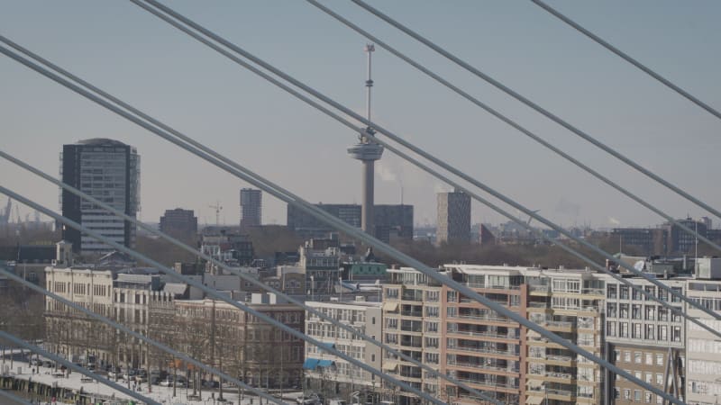 Euromast observation tower viewed through the cables of Erasmus Bridge in Rotterdam