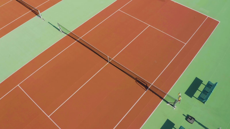 Close up aerial view of an empty tennis court