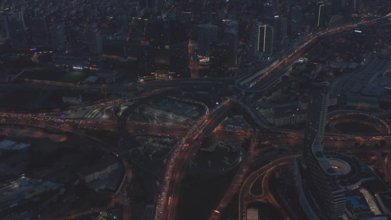 Traffic Jam on Huge Freeway Intersection in Istanbul at Dusk, Aerial forward tilt down