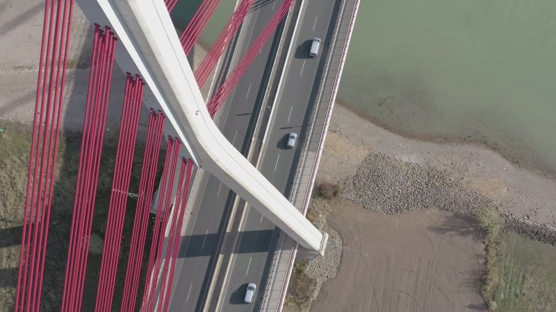 Vehicles Crossing a Cable Stayed Suspension Bridge Crossing a River