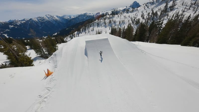 Junior Snowboarder Performing Jump in Flachau Funpark