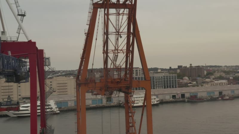 Close Up of industrial cranes in docks in New York City on cloudy day