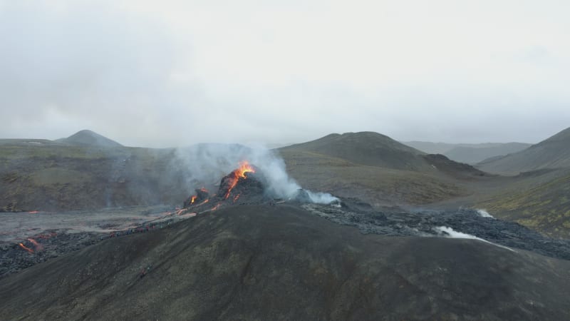 Aerial orbit of erupting volcano in Iceland