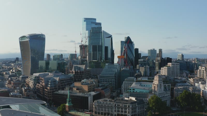 Fly around skyscrapers in City financial and economic centre. Walkie Talkie, Scalpel, Gherkin and other iconic modern office buildings. London, UK