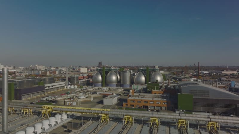 Forwards fly above industrial facility in town outskirts. Newtown Creek Wastewater Treatment in Brooklyn, New York City, USA