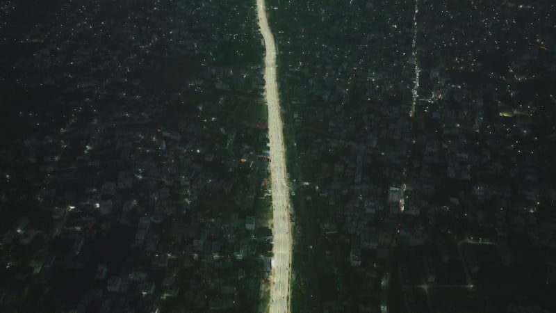 Aerial view of a road at night in Dhaka residential district, Bangladesh.