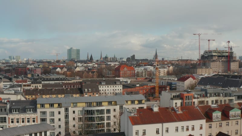 Aerial view of houses in residential neighborhood with church spires in the background in Hamburg, Germany