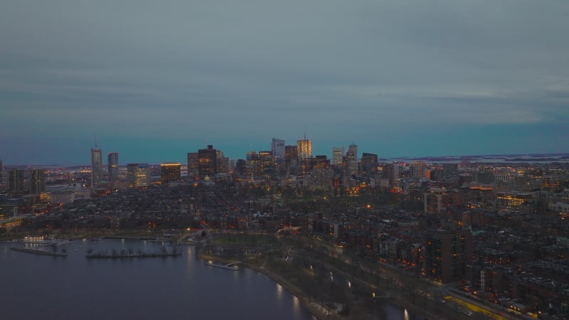 Aerial panoramic view of urban neighbourhood and high rise office buildings in background. Evening cityscape. Boston, USA