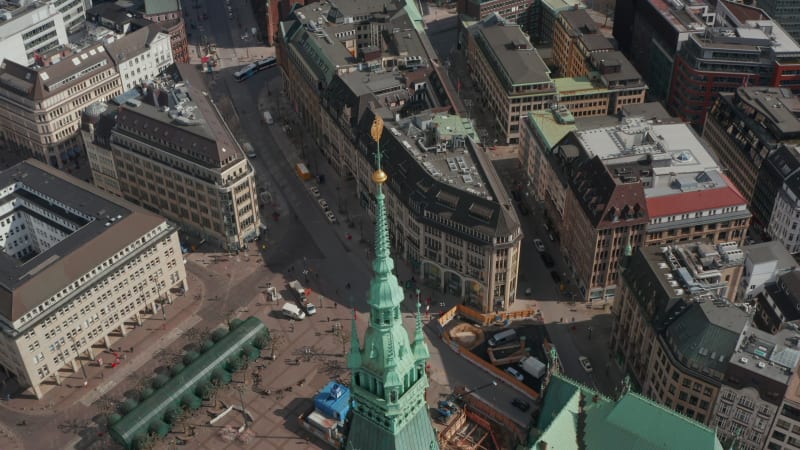 Aerial view of Hamburg city hall green roof with pedestrians and urban traffic on the streets below