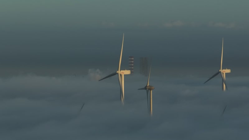 Windmills under Cloudy Skies near Westerchelde, Netherlands
