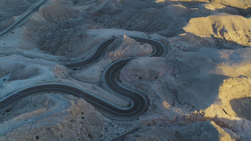 Aerial view of a twisty road in Jebel Hafeet, Abu Dhabi, United Arab Emirates.