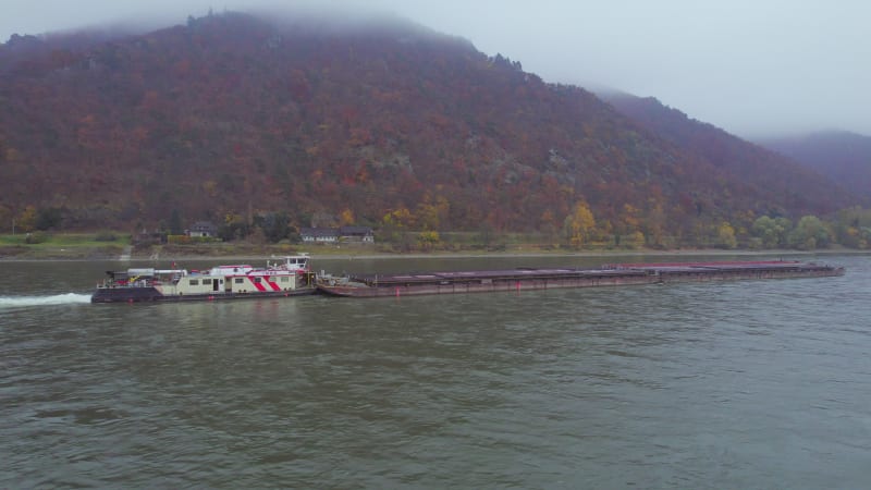 Cargo Pusher Boat on a River Transporting Cargo and Goods