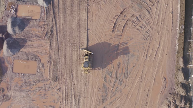 Bulldozer Using GPS Technology to Move Earth during Groundworks