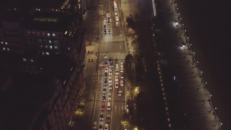 Aerial view of vehicles driving a busy road at night in Shanghai, China.