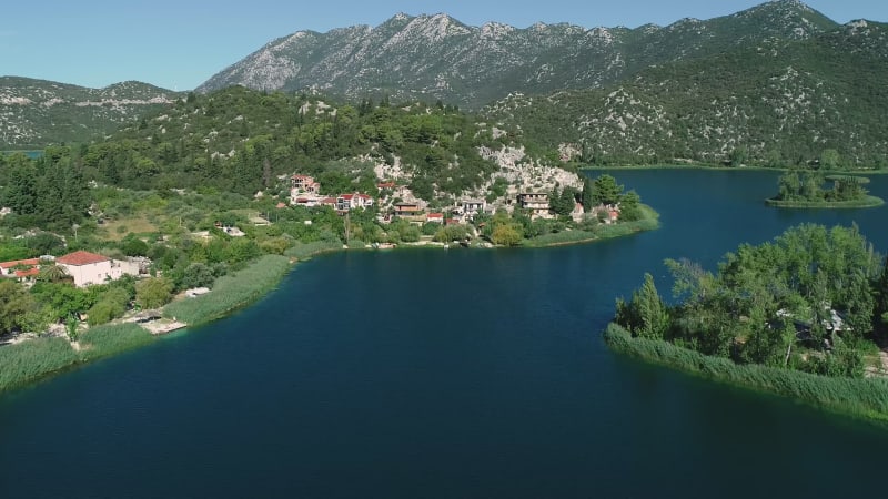 Aerial view of kitesurfing spot on the Neretva delta valley river.