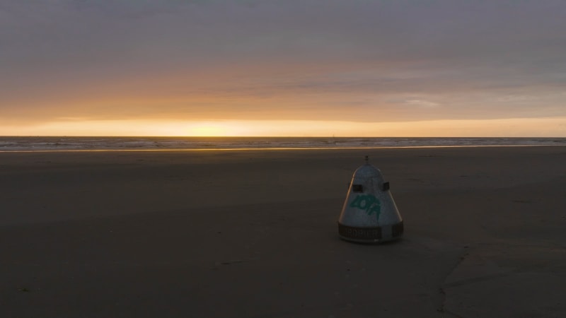 Overhead View of a Beachside Waste Bin at Dusk in Wijk Aan Zee, the Netherlands