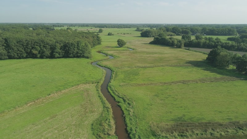 Aerial view of small winding river Reest.