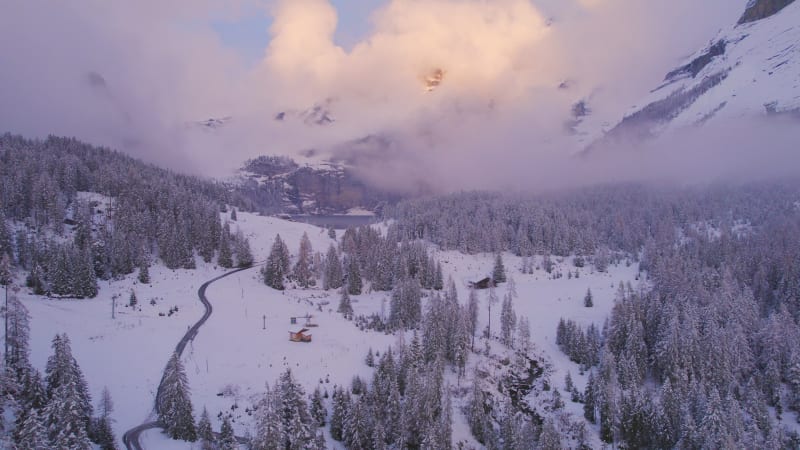 Oeschinen Lake in the Snowy Mountains of Switzerland on a Foggy Morning