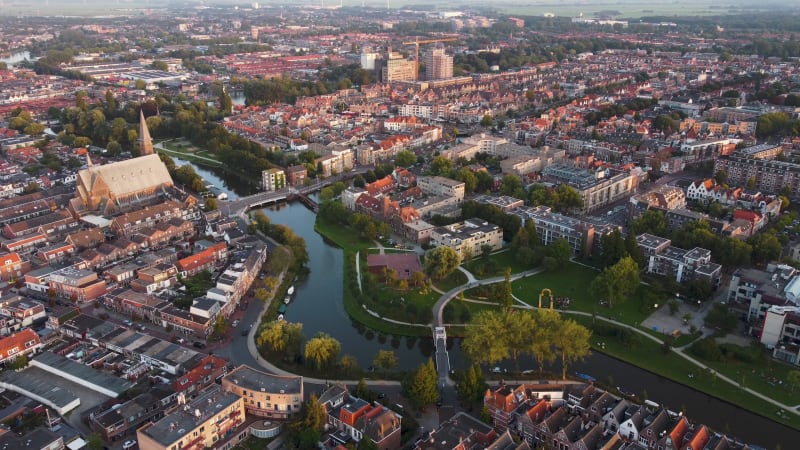 A water canal running through a residential area of Leiden, South Holland, Netherlands.