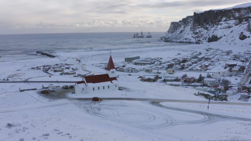 Vik Town and Church in Iceland with Ocean Views Seen From the Air